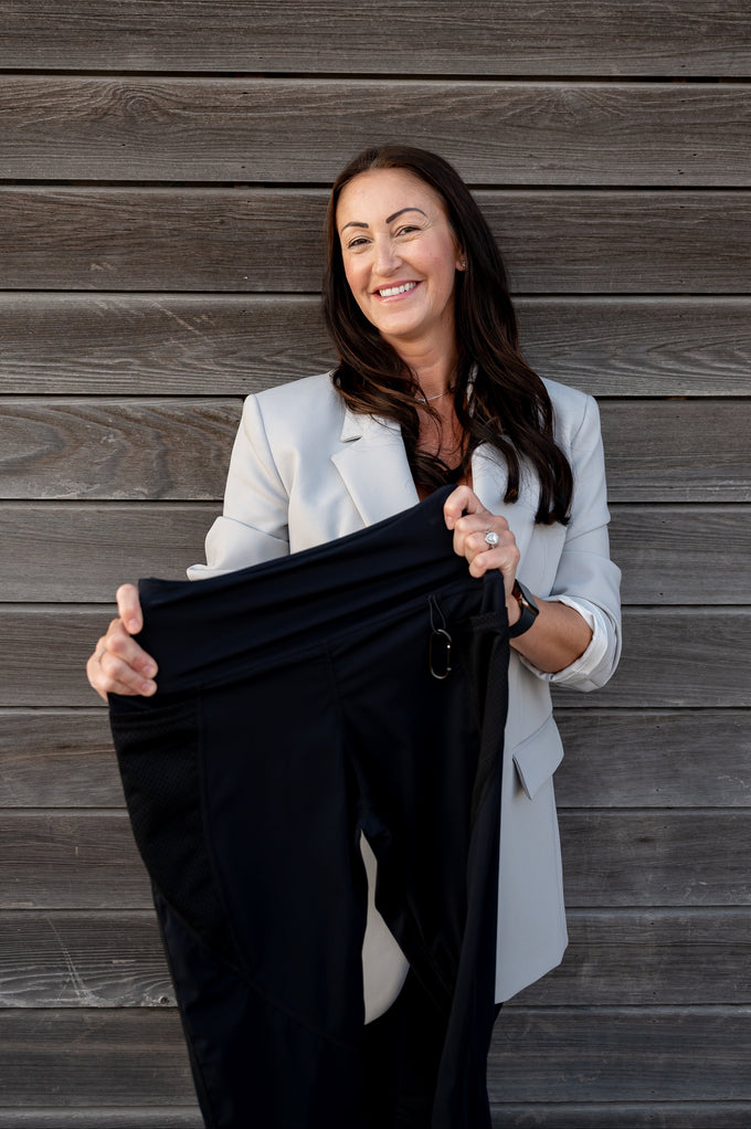  Kate holding a pair of black leggings